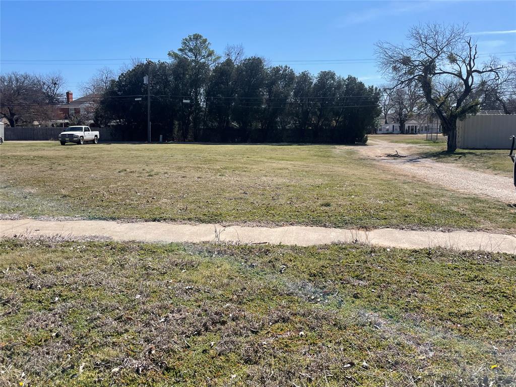908 4th Street Graham, TX 76450 - Photo 5 of 6 a view of yard with swimming pool and trees