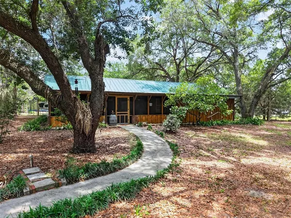 a backyard of a house with lots of green space