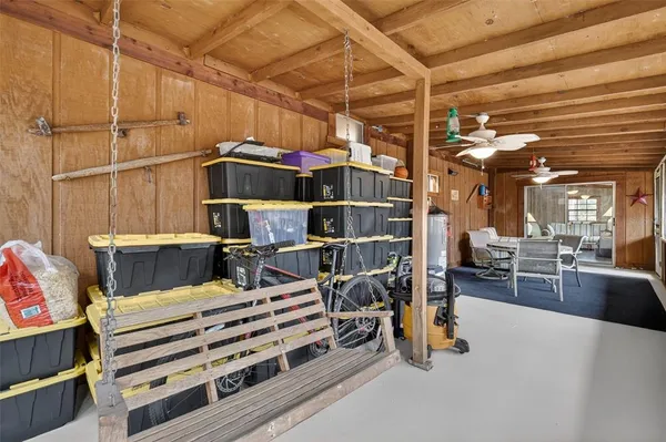 a bedroom with furniture and a chandelier