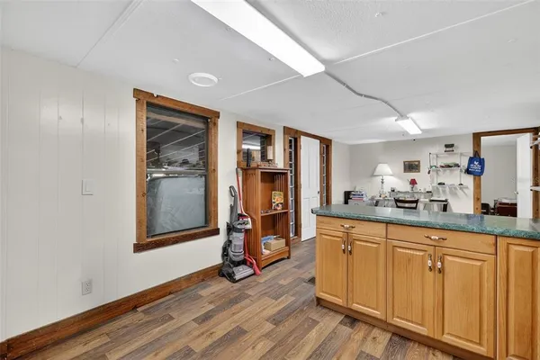 a kitchen with stainless steel appliances granite countertop a refrigerator and a stove top oven