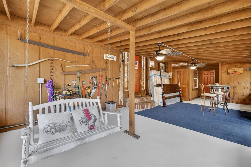 40635 Thomas Boat Landing Road Umatilla, FL 32784 - Photo 20 of 44 a bedroom with furniture and a chandelier