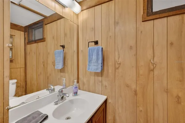 a en suite bathroom with a sink and mirror