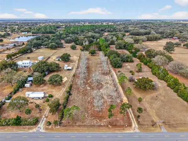 a bedroom with furniture and a chandelier