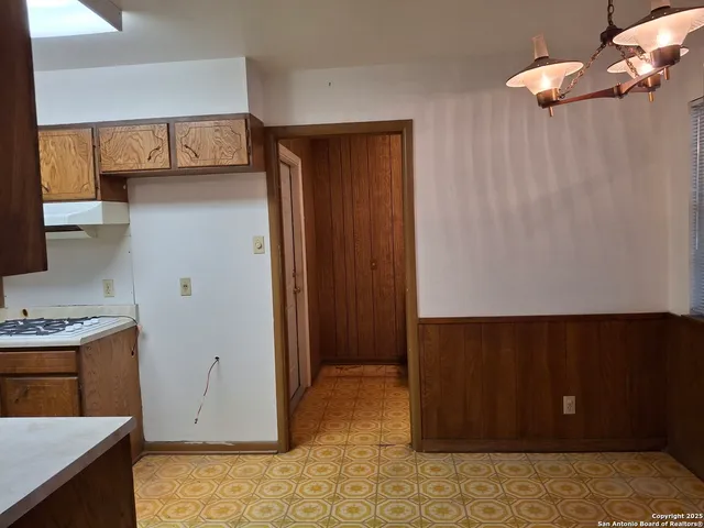 a view of kitchen with cabinets