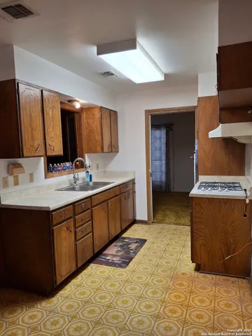 a spacious bathroom with a double vanity sink and a mirror