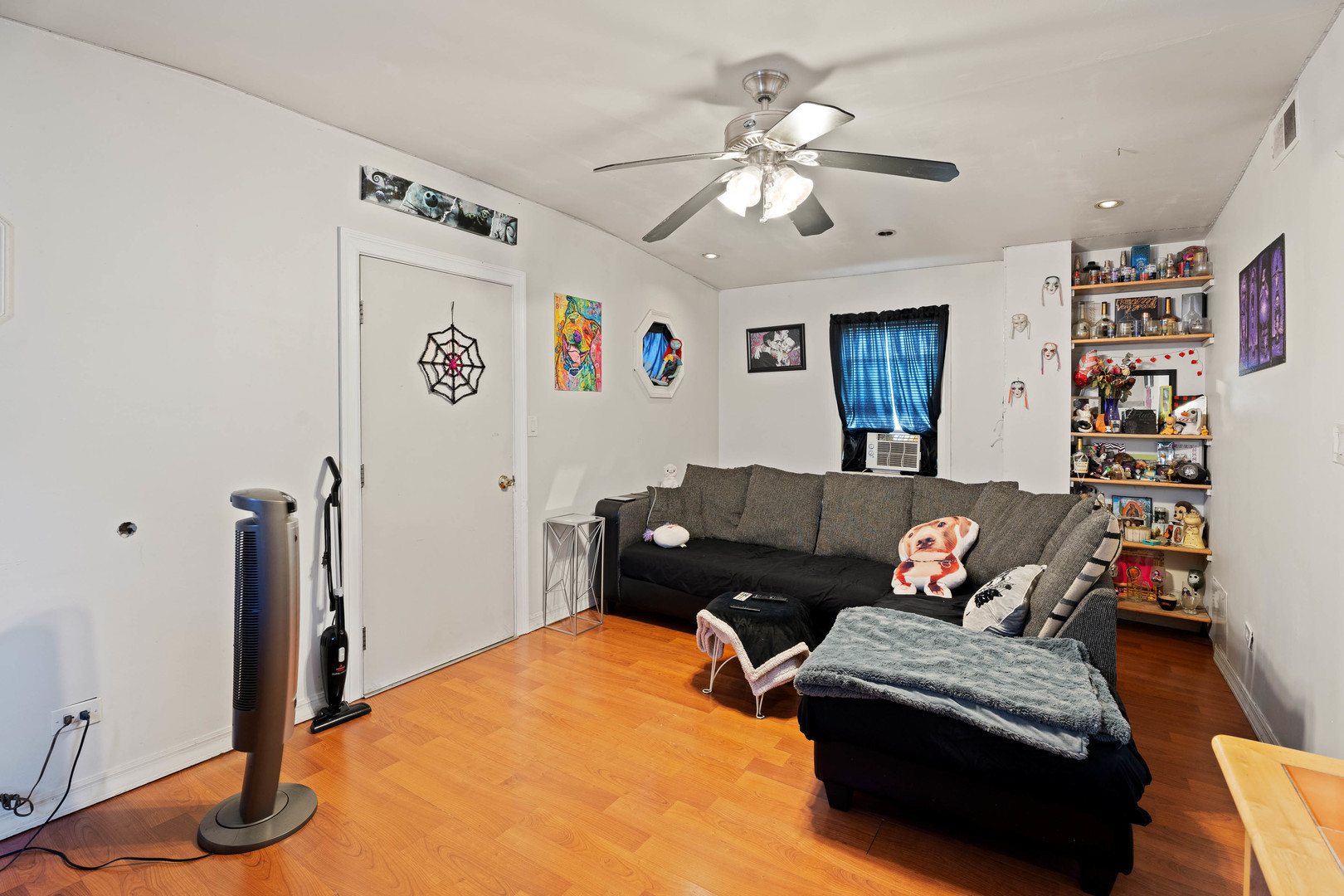 4512 South Fairfield Avenue, Unit 3 Chicago, IL 60632 - Photo 2 of 5 a living room with furniture and a flat screen tv