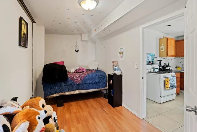 a bedroom with a bed and cabinets