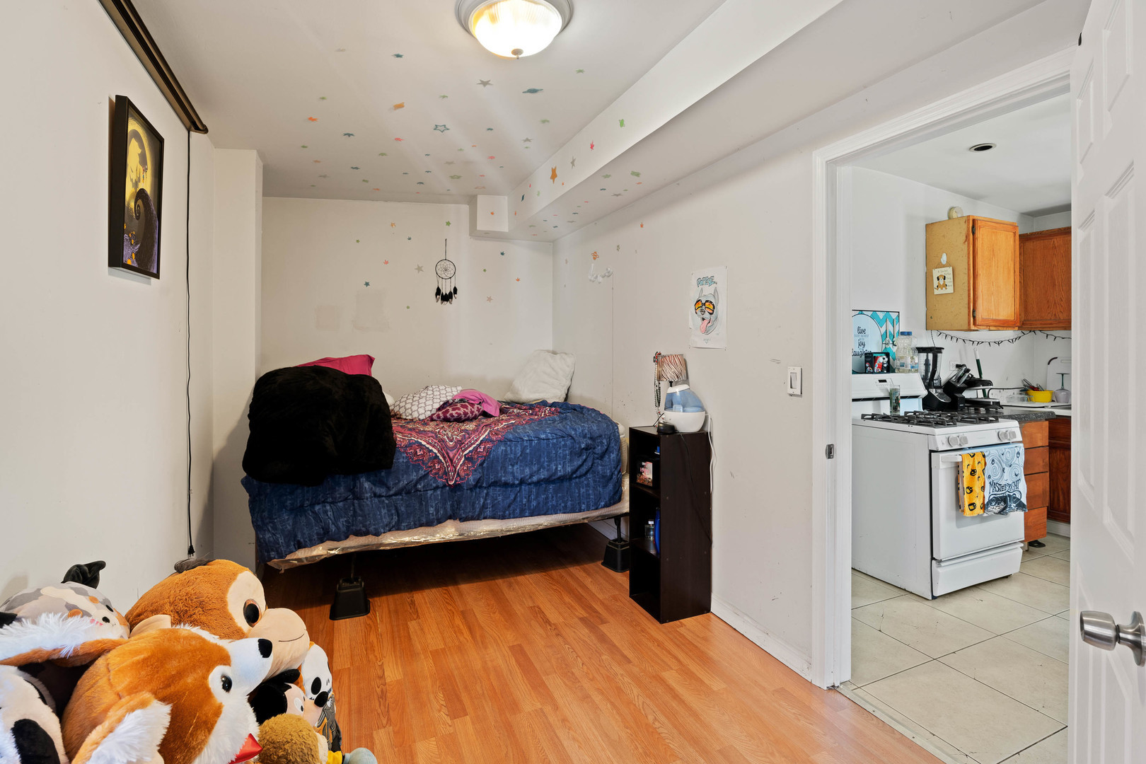 4512 South Fairfield Avenue, Unit 3 Chicago, IL 60632 - Photo 4 of 5 a bedroom with a bed and cabinets