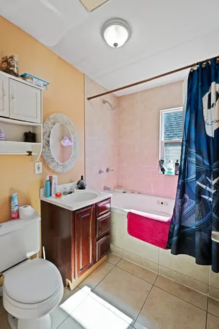 a bathroom with a sink a toilet and mirror