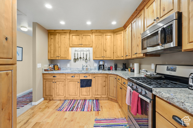 2490 South State Street Springville, UT 84663 - Photo 27 of 38 Kitchen featuring baseboards, recessed lighting, stainless steel appliances, and light wood finished floors