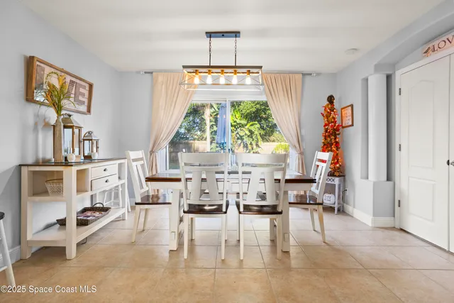 a view of kitchen with dining table and chairs