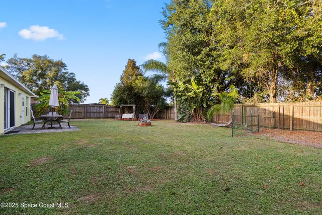 a view of outdoor space with deck and yard