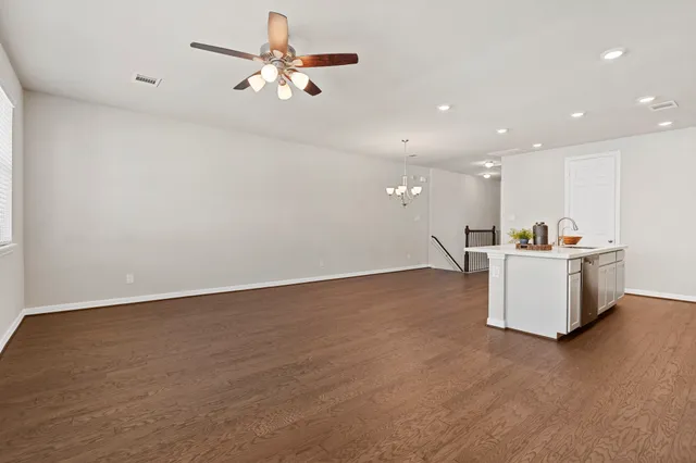 a kitchen with stainless steel appliances a refrigerator a stove a sink and a oven