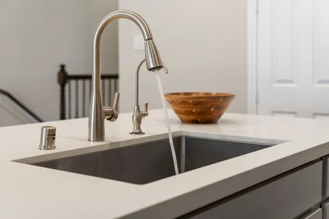 a view of a kitchen with microwave and cabinets