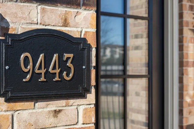 a view of hallway with stairs and wooden floor