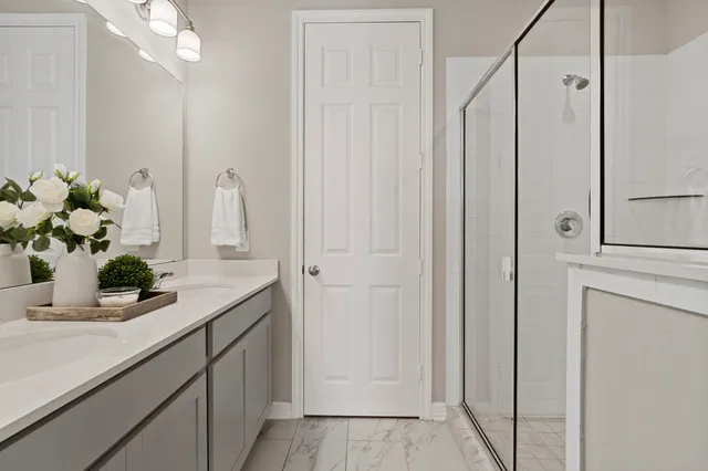 a bathroom sink mirror and vanity