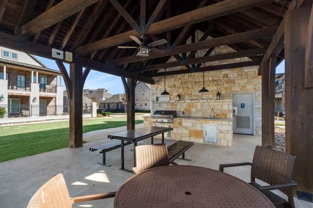 a view of a swimming pool with sitting area