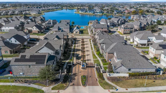 an aerial view of residential houses with outdoor space