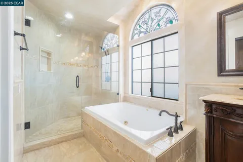 a bathroom with a bathtub and a shower