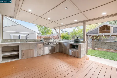 a kitchen with stainless steel appliances a stove top oven and sink