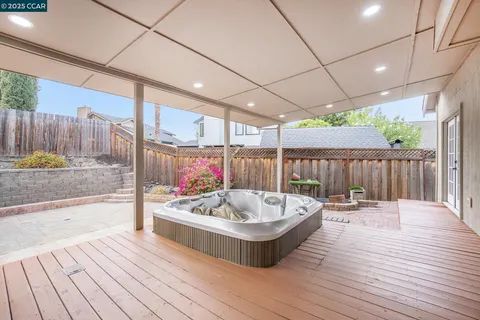 a outdoor space with patio bathtub and wooden floor