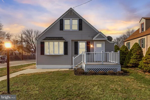 a view of a house with a small yard
