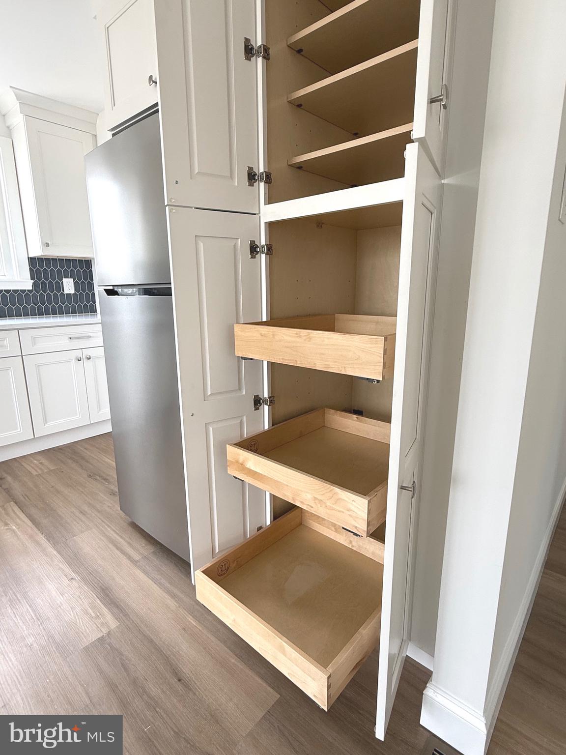 42 Spruce Avenue Maple Shade, NJ 08052 - Photo 14 of 27 a kitchen with a refrigerator and wooden floor