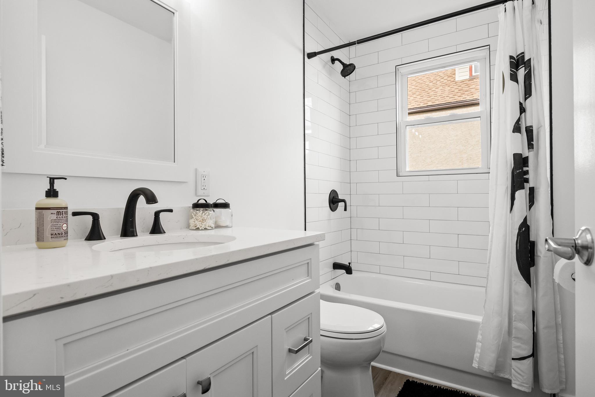 42 Spruce Avenue Maple Shade, NJ 08052 - Photo 16 of 27 a bathroom with a sink a toilet and a bathtub