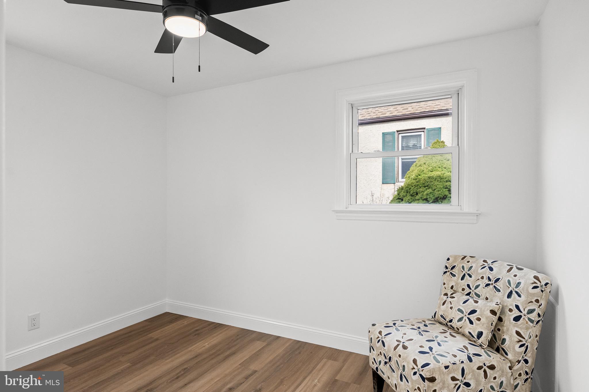 42 Spruce Avenue Maple Shade, NJ 08052 - Photo 18 of 27 an empty room with a window and wooden floor