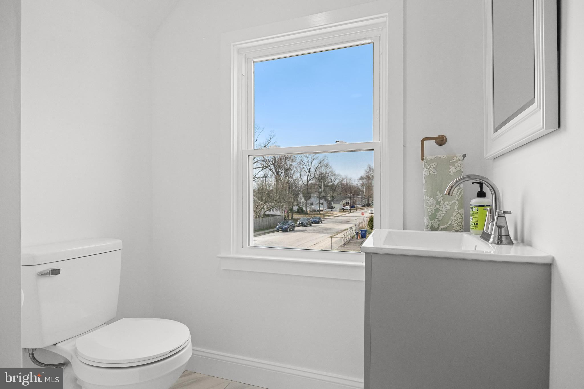 42 Spruce Avenue Maple Shade, NJ 08052 - Photo 22 of 27 a bathroom with a sink a toilet and a window