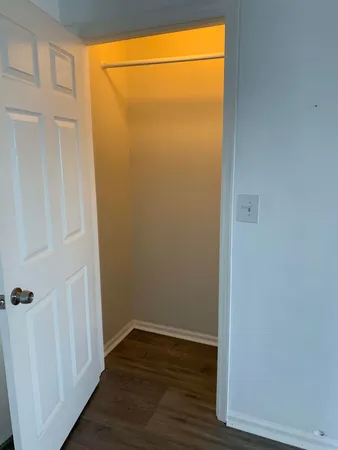 a view of a small space with wooden floor