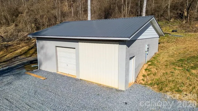 a backyard of a house with large trees