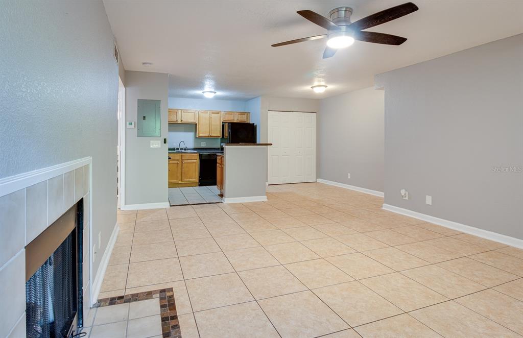 415 Lakepointe Drive, Unit 202 Altamonte Springs, FL 32701 - Photo 1 of 1 a view of open kitchen with a sink and a fireplace