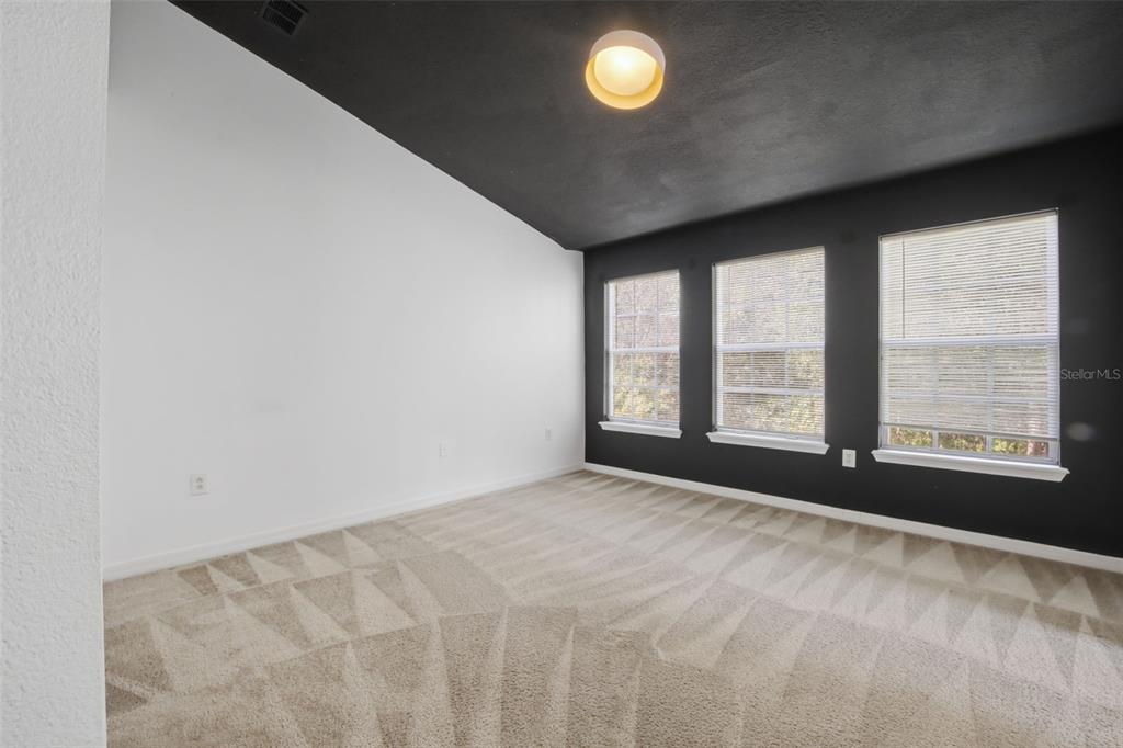 27547 Pleasure Ride Loop Wesley Chapel, FL 33544 - Photo 19 of 40 a view of an empty room with a window