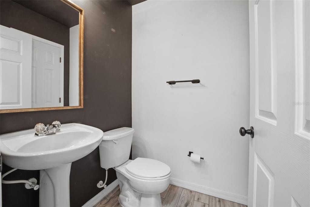 27547 Pleasure Ride Loop Wesley Chapel, FL 33544 - Photo 28 of 40 a bathroom with a sink toilet and a mirror