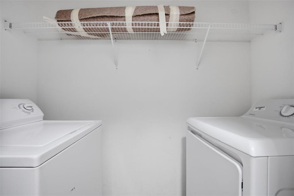 27547 Pleasure Ride Loop Wesley Chapel, FL 33544 - Photo 29 of 40 a utility room with dryer and washer