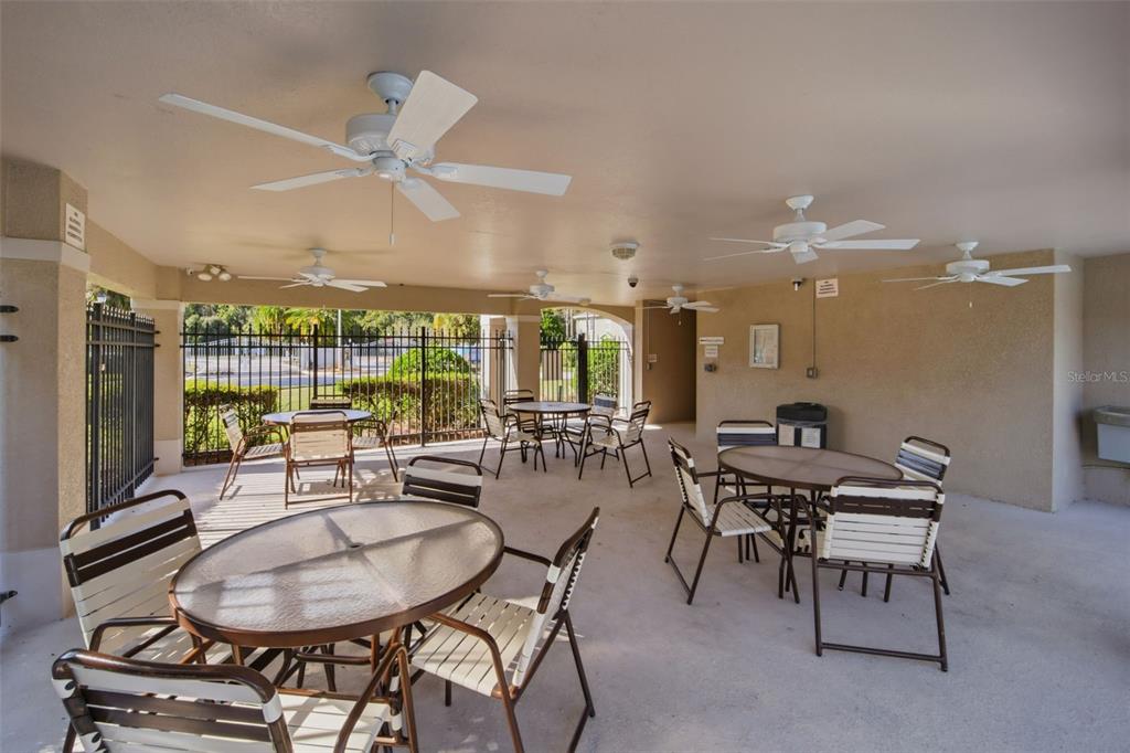 27547 Pleasure Ride Loop Wesley Chapel, FL 33544 - Photo 35 of 40 a view of a dining room with furniture wooden floor and chandelier