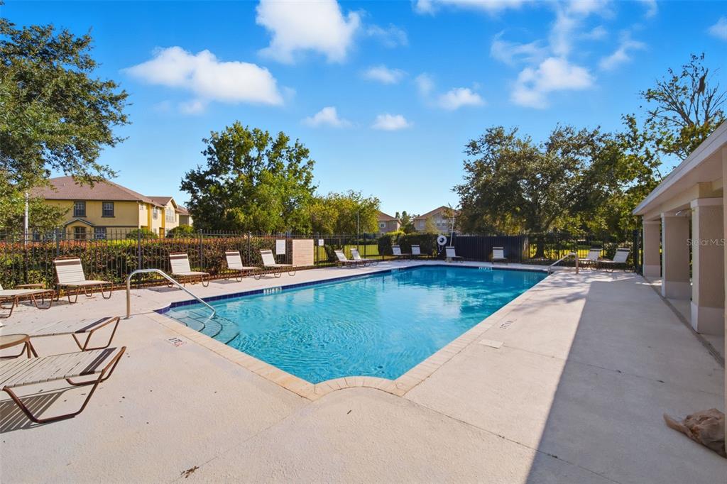 27547 Pleasure Ride Loop Wesley Chapel, FL 33544 - Photo 36 of 40 a view of swimming pool with outdoor seating and plants