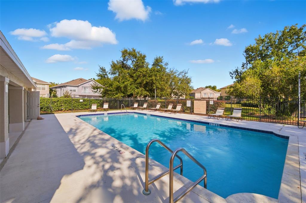 27547 Pleasure Ride Loop Wesley Chapel, FL 33544 - Photo 37 of 40 a view of a swimming pool with a lounge chair