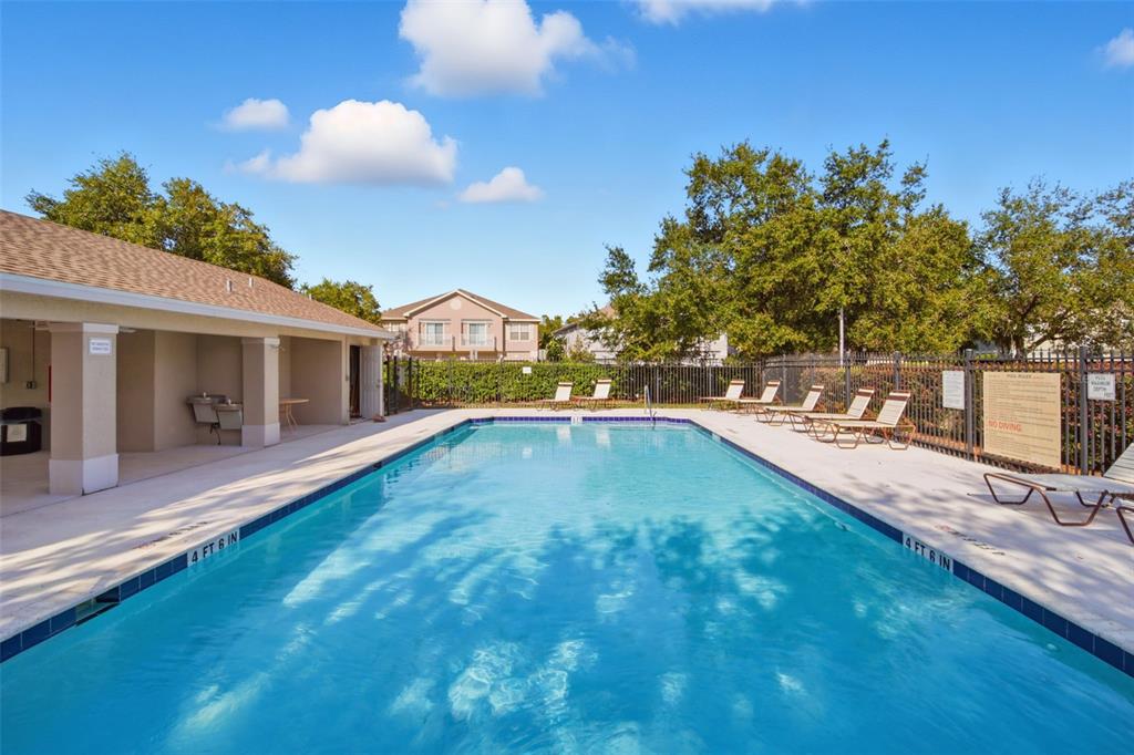 27547 Pleasure Ride Loop Wesley Chapel, FL 33544 - Photo 38 of 40 a swimming pool view with a outdoor space