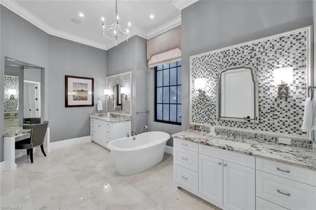a spacious bathroom with a shower sink and mirror