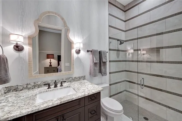 a living room with large window and a flat screen tv