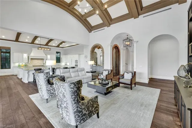 a living room with couches and a large window with outer view