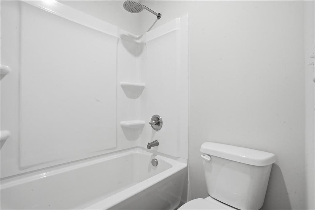 5351 Tolar Road South Fulton, GA 30213 - Photo 26 of 30 a bathroom with a toilet and a bathtub