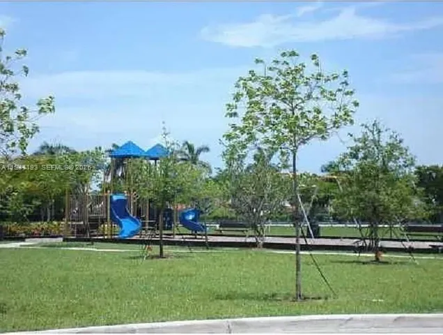 a view of a golf course with a lake