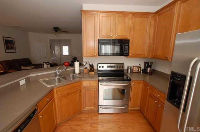 7038 Racine Way Raleigh, NC 27615 - Photo 5 of 12 Another view of the kitchen that opens to the living room and dining room Other