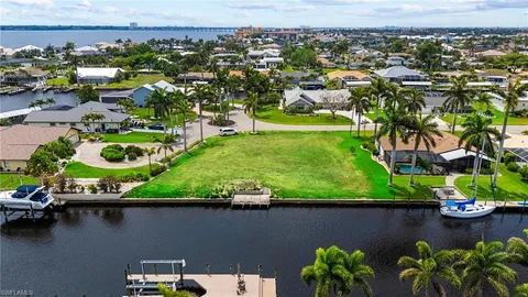 an aerial view of a house with a lake view