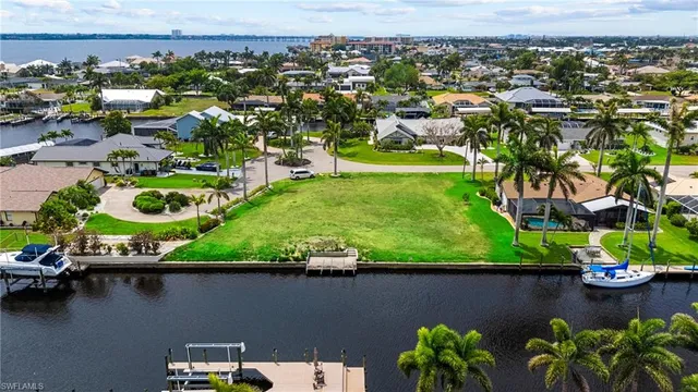 an aerial view of a house with a lake view