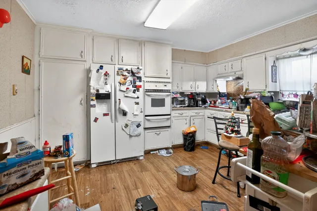 a view of a kitchen with workspace and a window