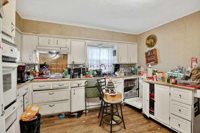 a kitchen with a sink and cabinets